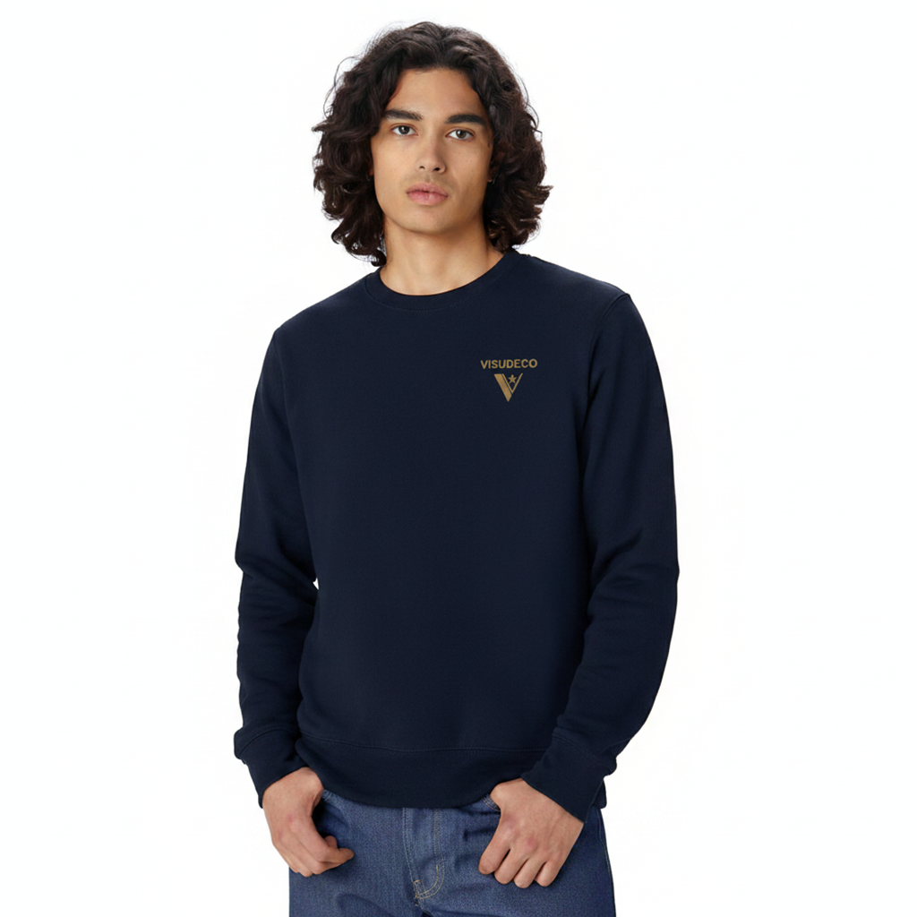 Person wearing a navy blue sweatshirt with a logo on the front.