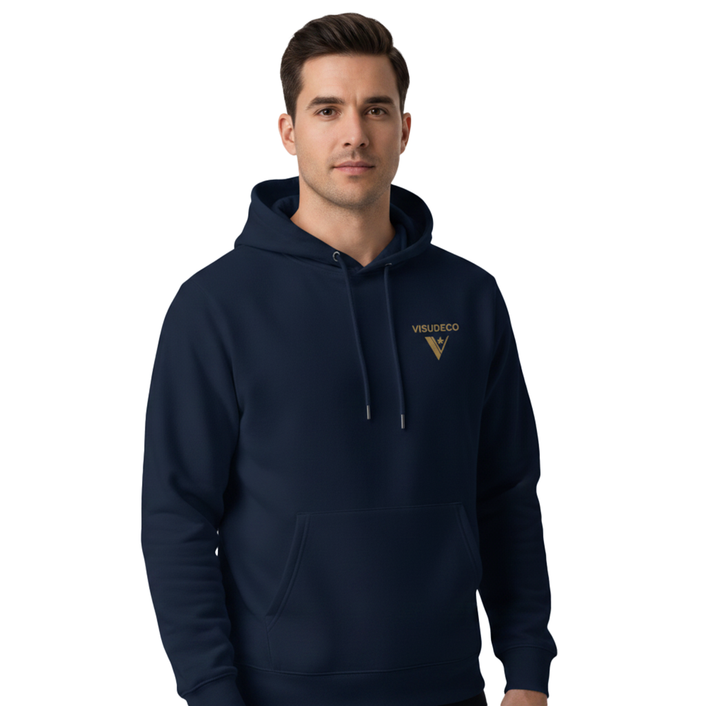 A man wearing a navy blue hoodie with a golden logo and triangular emblem on the left chest, set against a plain white background.