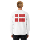 A man wearing a white sweatshirt with a Danish flag on the back.