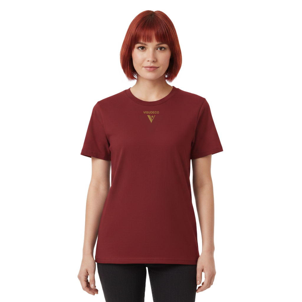 A woman with short red hair wearing a maroon short-sleeve crewneck t-shirt with a gold VISUDECO logo on the chest, paired with black pants, against a plain white background.