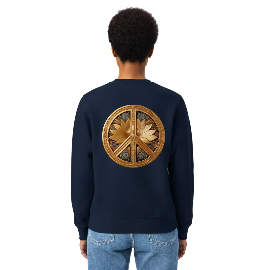 A person viewed from the back wearing a navy crewneck sweatshirt with a large circular gold peace sign and lotus flower graphic on the back, paired with light blue jeans, against a plain white background.