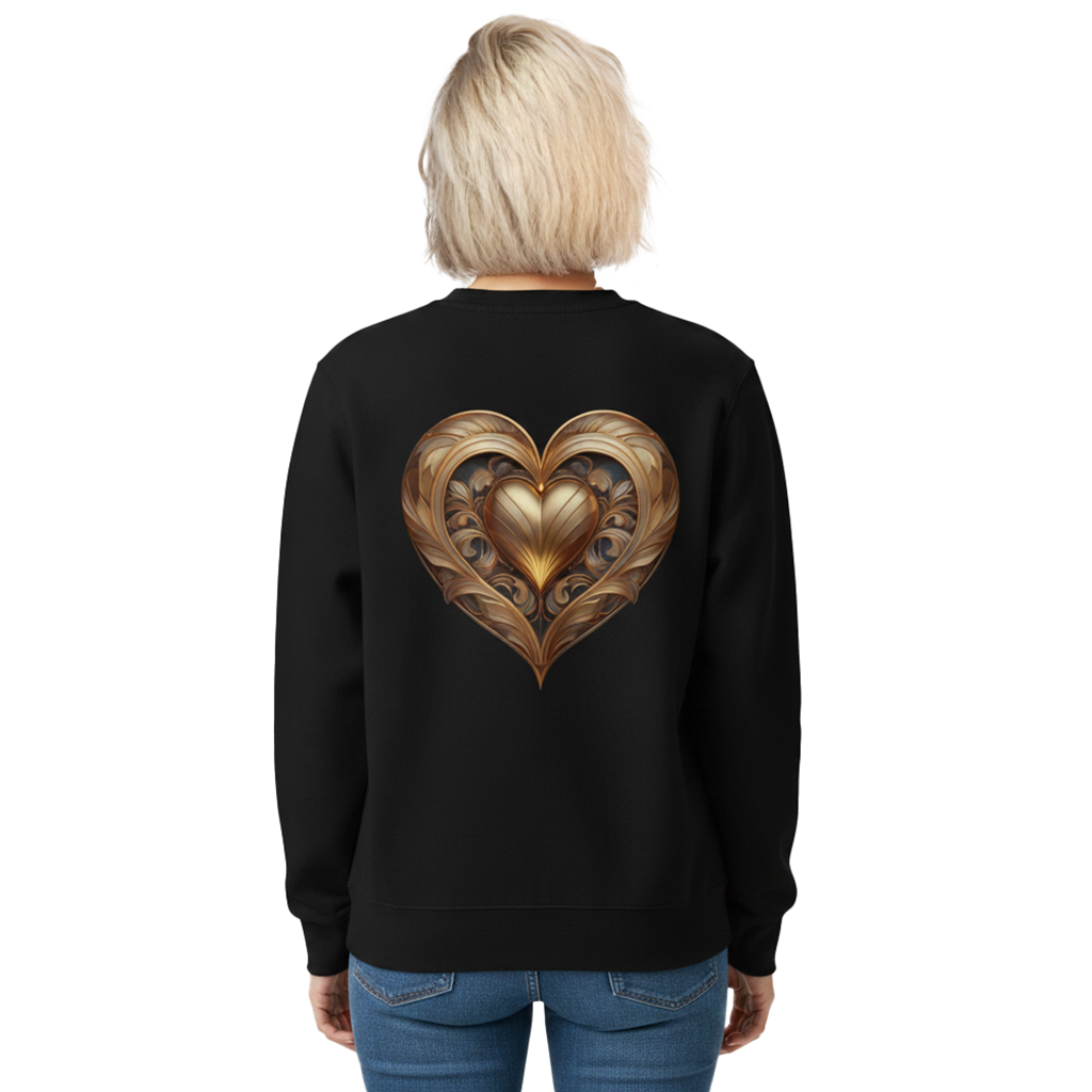 A woman viewed from the back wearing a black crewneck sweatshirt with a large, detailed metallic gold heart graphic on the back, paired with blue jeans against a plain white background.