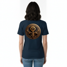 Woman wearing a navy blue t-shirt with a bronze emblem on the back.