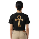 Woman wearing a black t-shirt with a golden symbol on the back.