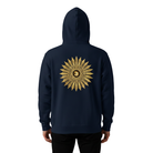 Person wearing hoodie with a golden sun on the back.