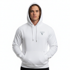 Man wearing white hoodie, seen from the front with logo in front and hood over his head.