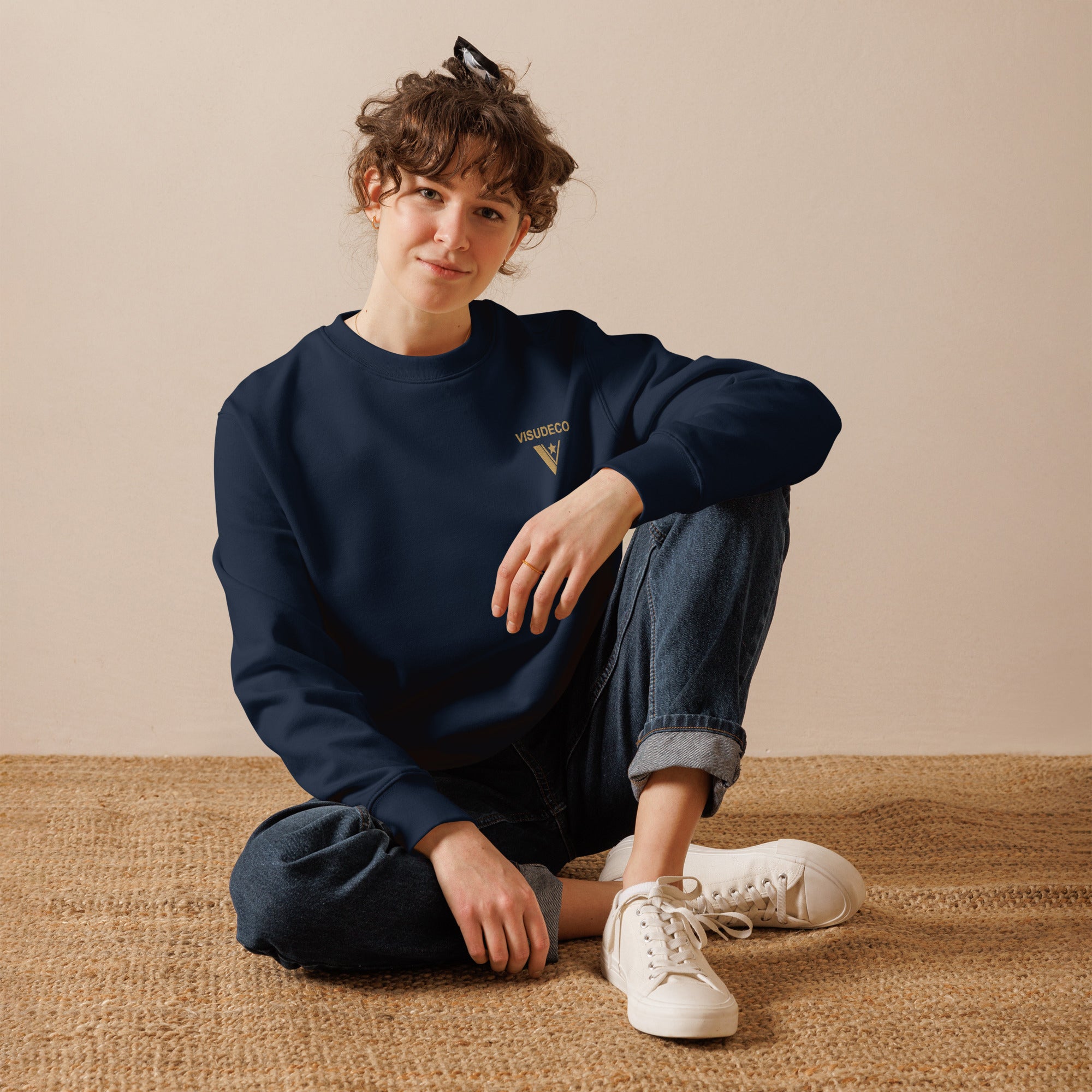 Organic Cotton Sweatshirt in Navy Blue on female model with logo embroidered on the front.