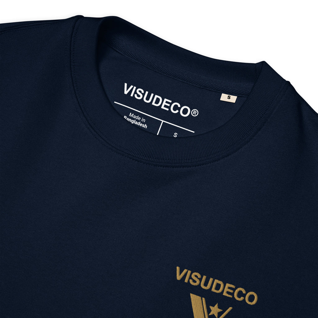 Close up of organic cotton sweatshirt in navy blue showing inside label.