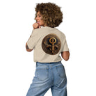 Key of Empathy - Organic Cotton T-Shirt in Desert Dust on female model with symbol printed on back.